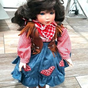 Ceramic cowgirl doll. 14 inches long
